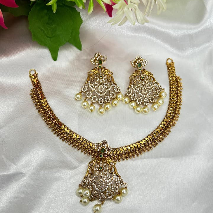 Traditional temple-style short necklace with rich antique gold polish.